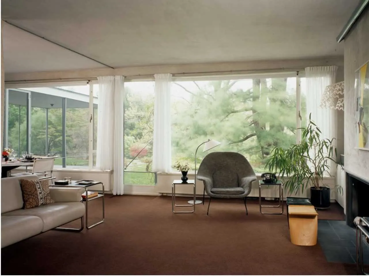 Bauhaus furnishings, oversized windows and an open floor plan could feel stark and austere, yet at the Gropius House the living and dining areas feel cozy and personal.