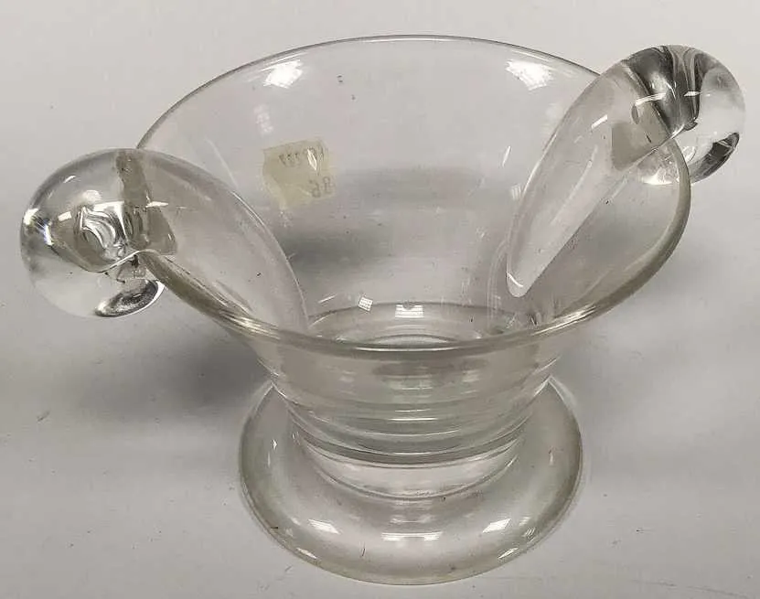 Steuben glass candy dish with two handles, sold in a 2018 auction at Skinner.